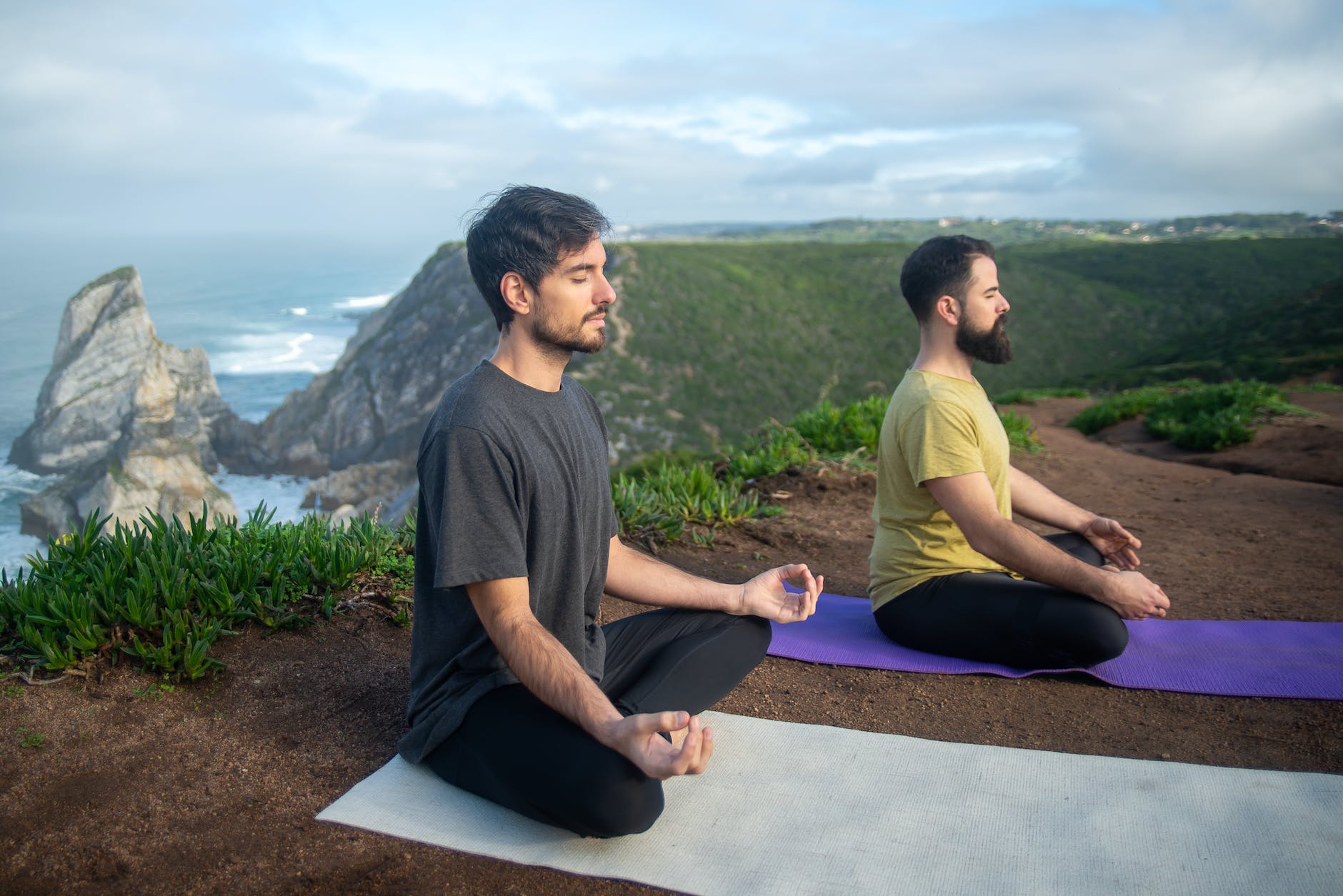 two men doing yoga